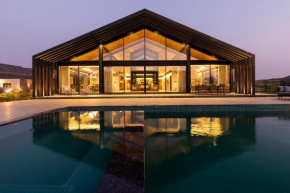 StayVista's The Barn - Mountain-View Luxury Mansion with Heated Infinity Pool, Deck, Jacuzzi, Lawn featuring a Gazebo and Firepit